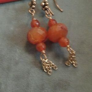 Gemstone and copper earrings.